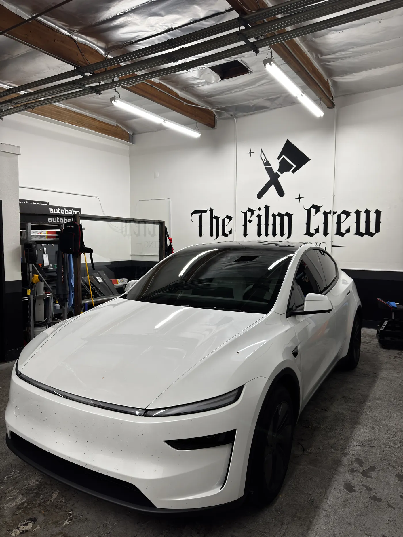 Black sports coupe with dark tint at The Film Crew Automotive