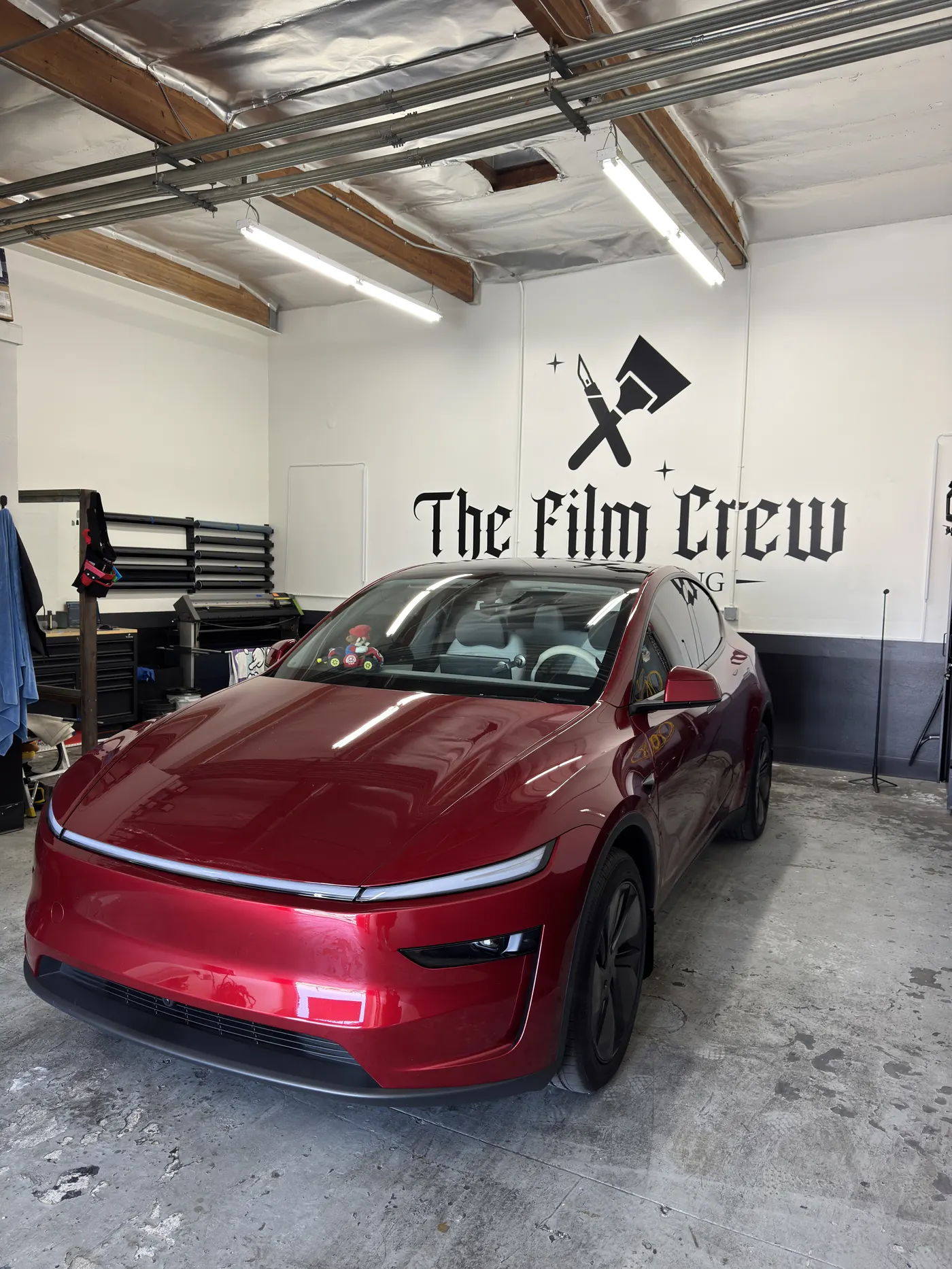 Classic lowrider with fresh window tint in the shop