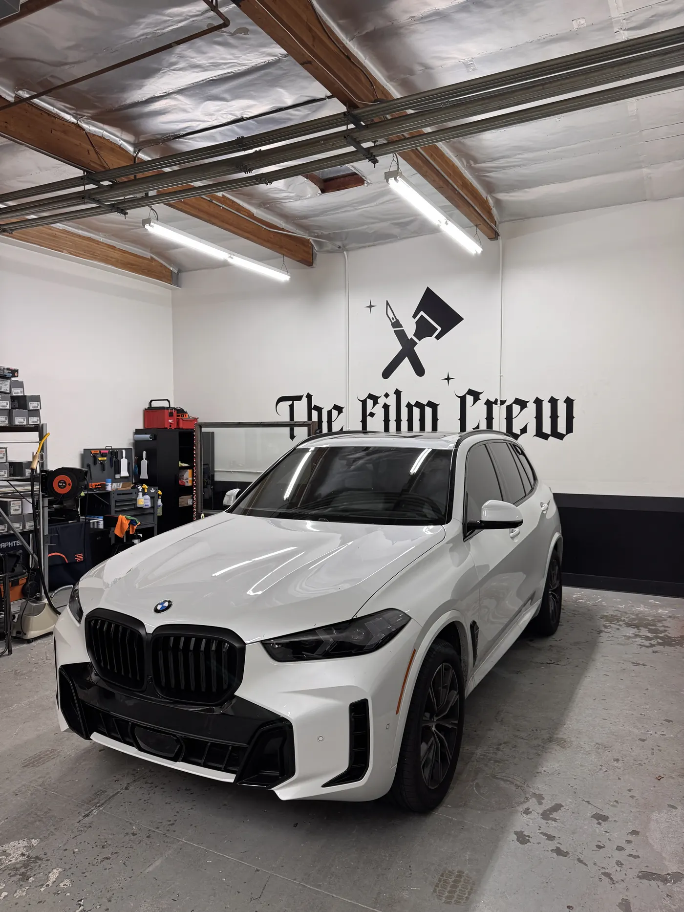 White sedan side profile showing fresh window tint